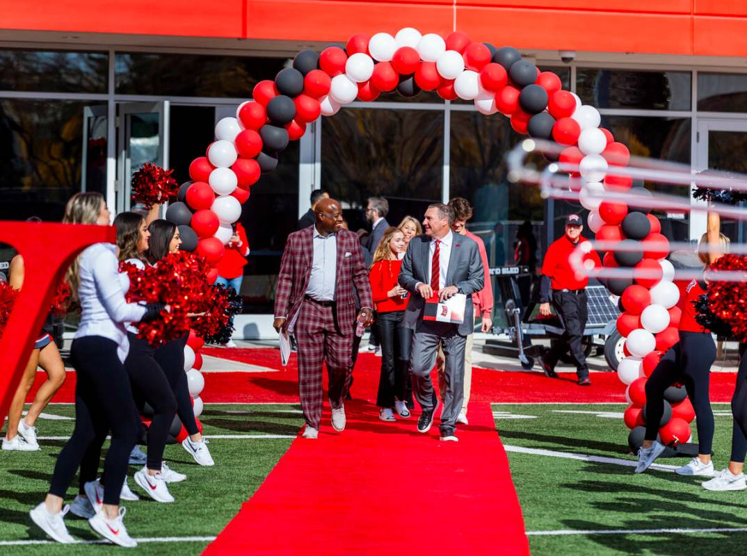 UNLV athletic director Erick Harper, left, arrives with Dan Mullen and his family as they intro ...