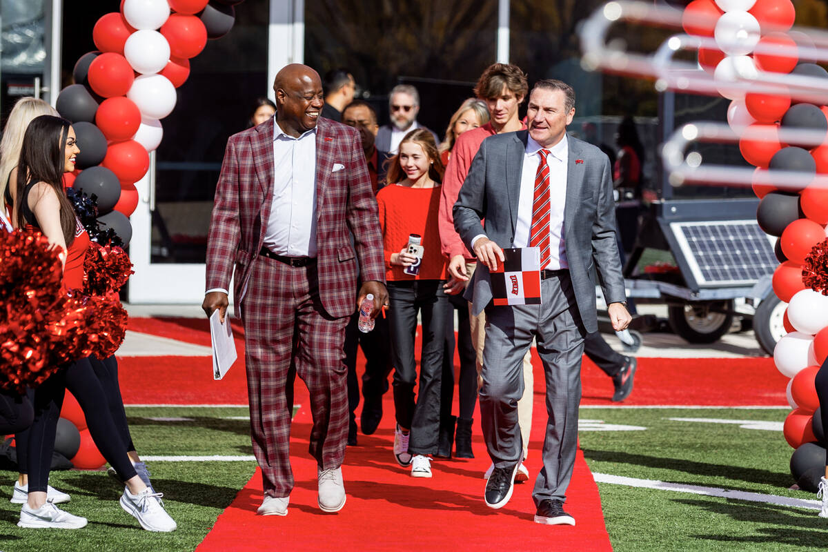 UNLV athletic director Erick Harper, left, arrives with Dan Mullen and his family as they intro ...