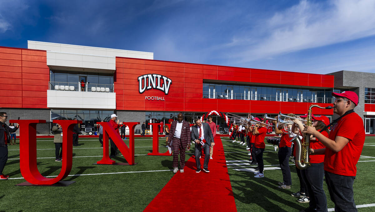 UNLV athletic director Erick Harper, left, arrives with Dan Mullen and his family as they intro ...