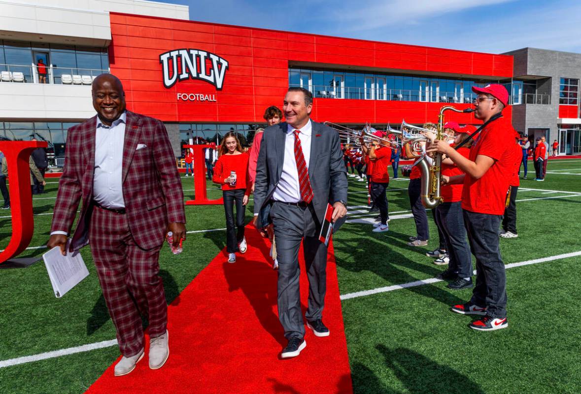 UNLV athletic director Erick Harper, left, arrives with Dan Mullen and his family as they intro ...