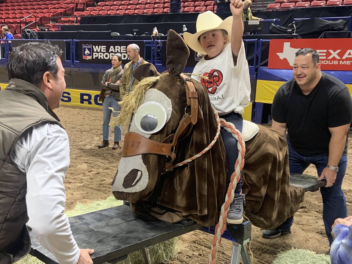 Nine-year-old Emme Sullivan keeps her focus while riding the seesaw bucking horse during Thursd ...