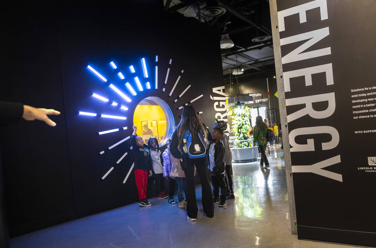 People explore the energy exhibit during a tour of the Discovery Children’s Museum on Tu ...