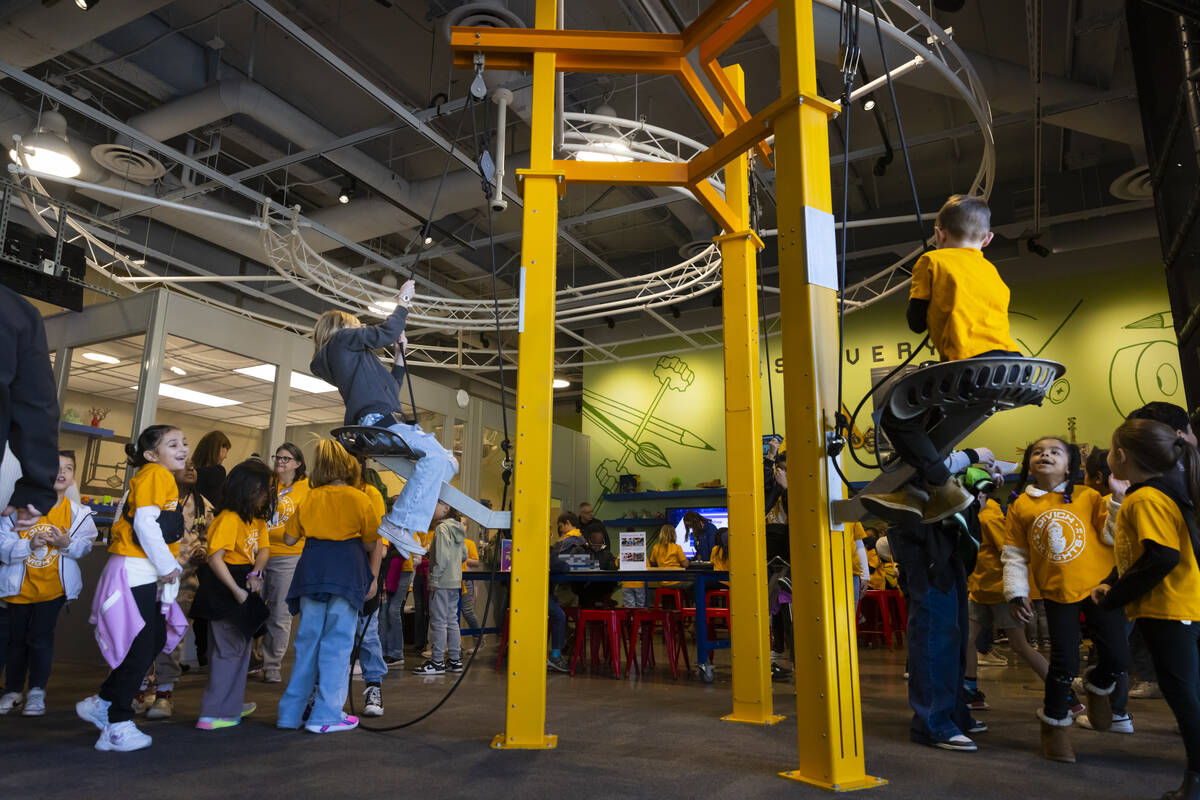 Children play with a pulley system during a tour of the Discovery Children’s Museum on T ...