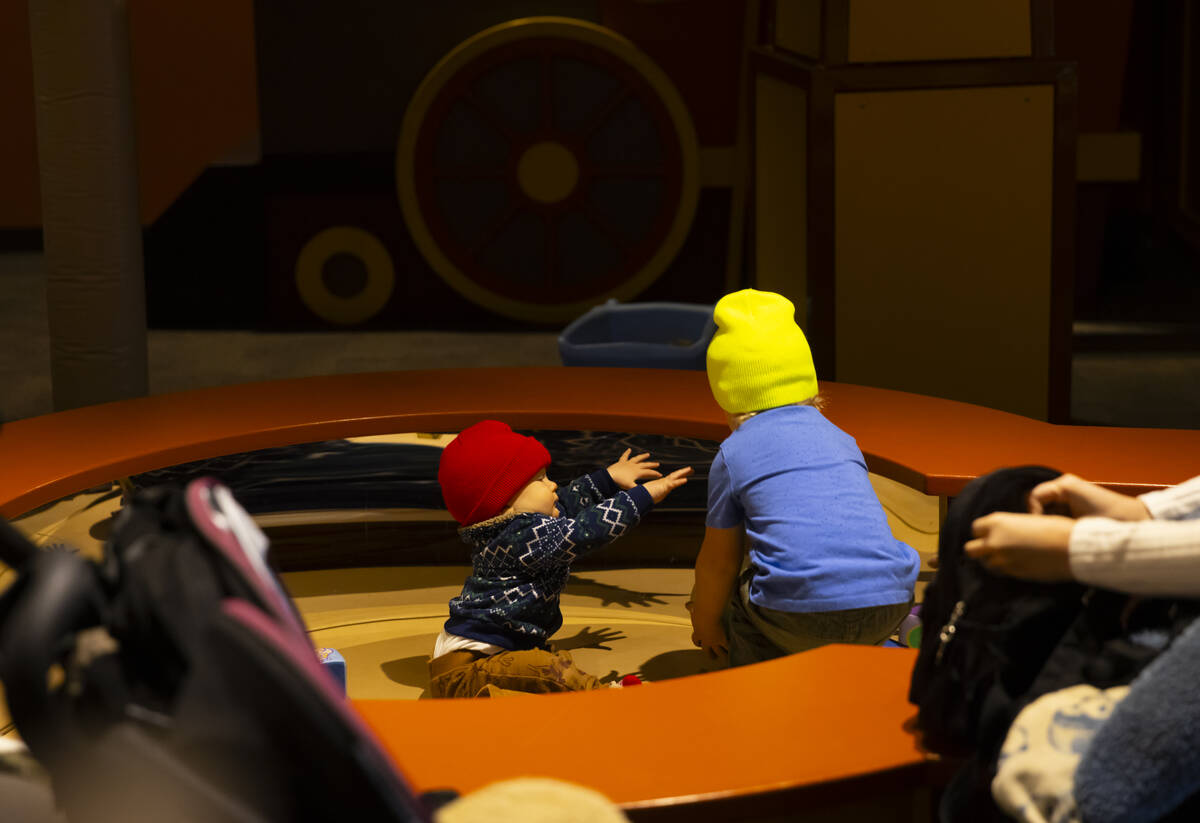 Children play in the toddler town area during a tour of the Discovery Children’s Museum ...