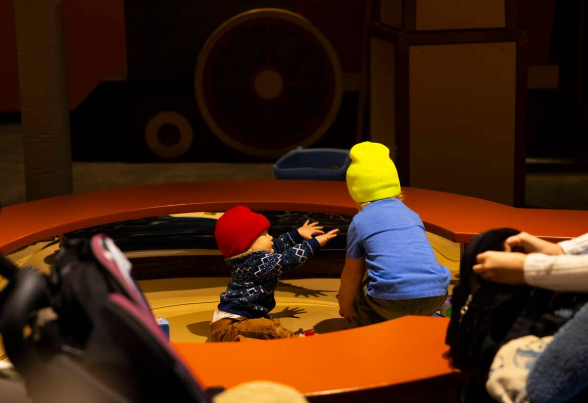 Children play in the toddler town area during a tour of the Discovery Children’s Museum ...