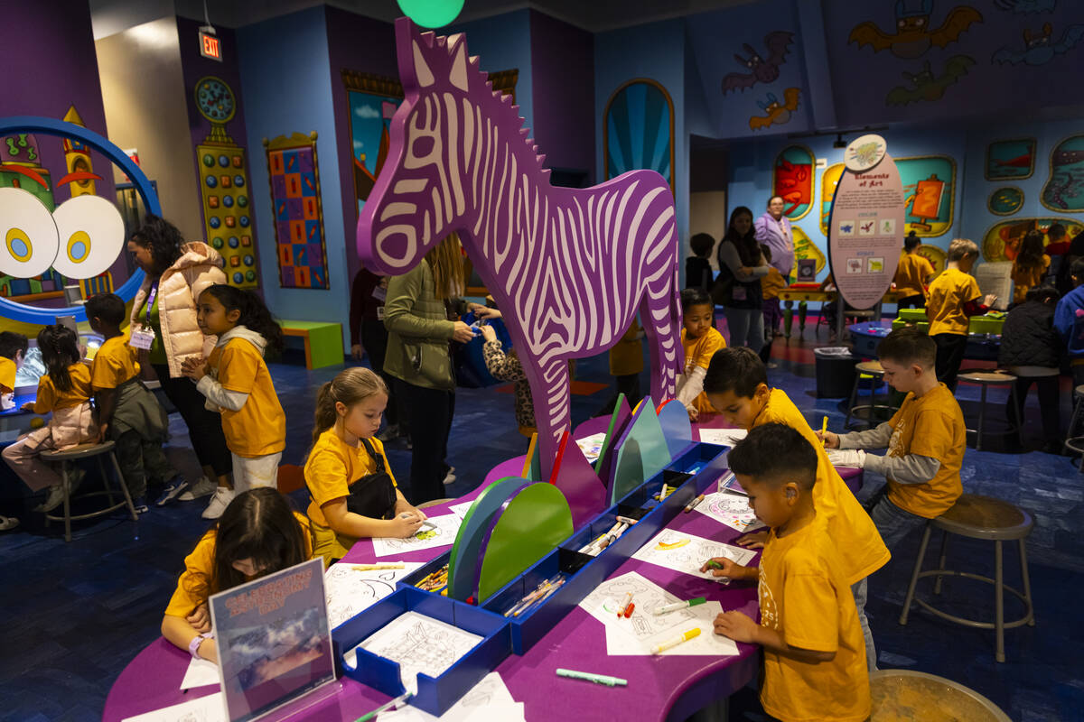 Children work on drawings during a tour of the Discovery Children’s Museum on Tuesday, D ...