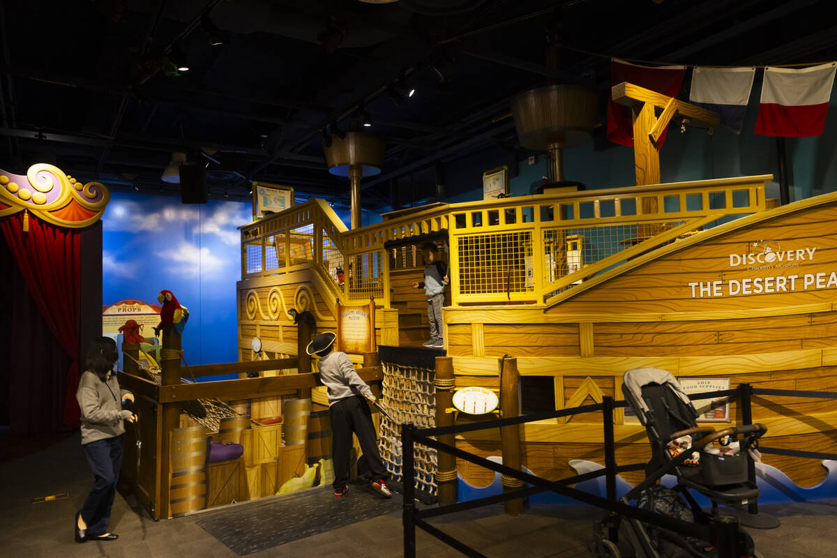 Children play around a pirate ship in the fantasy festival area during a tour of the Discovery ...