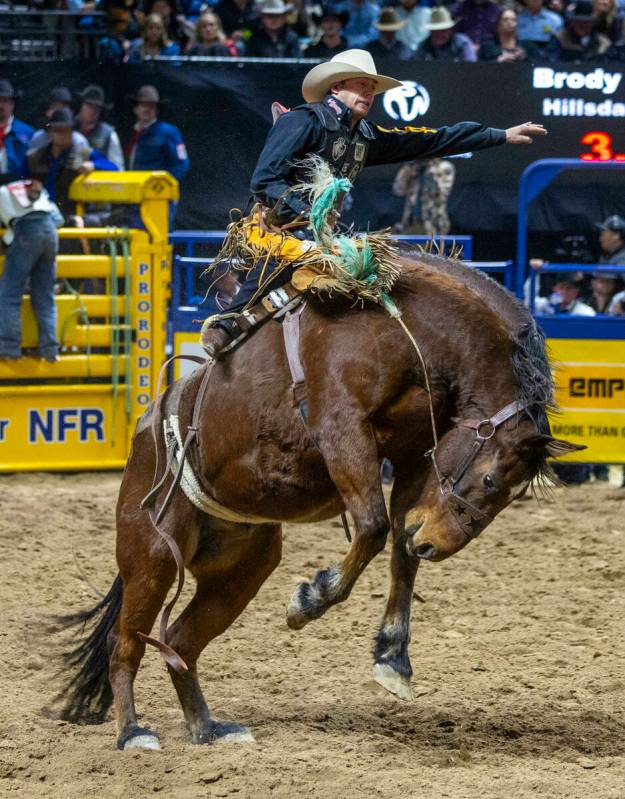 Saddle Bronc Riding contestant Brody Cress rides Wall Street to a winning score during National ...