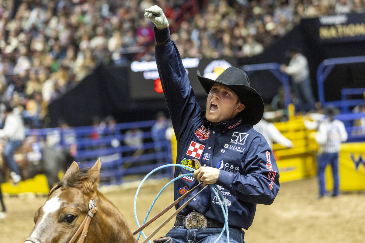 Logan Medlin celebrates after competing in the team roping event during day nine of the Nationa ...