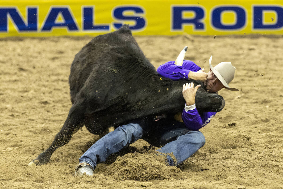 Tyler Waguespack pulls on a steer in the steer wrestling event during day nine of the National ...