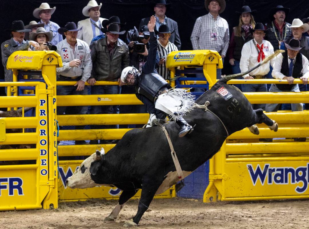 Trey Kimzey competes in the bull riding event during day nine of the National Finals Rodeo at t ...