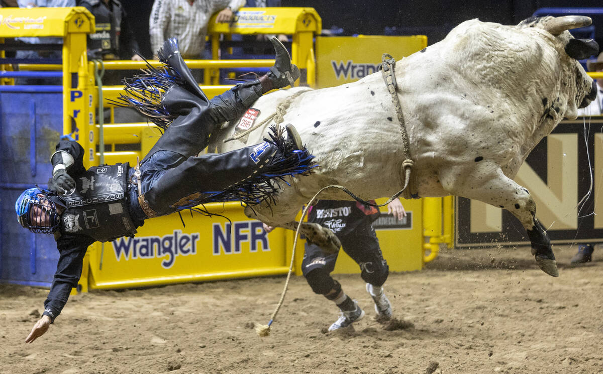 Tristen Hutchings falls off of James Bond in the bull riding event during day nine of the Natio ...