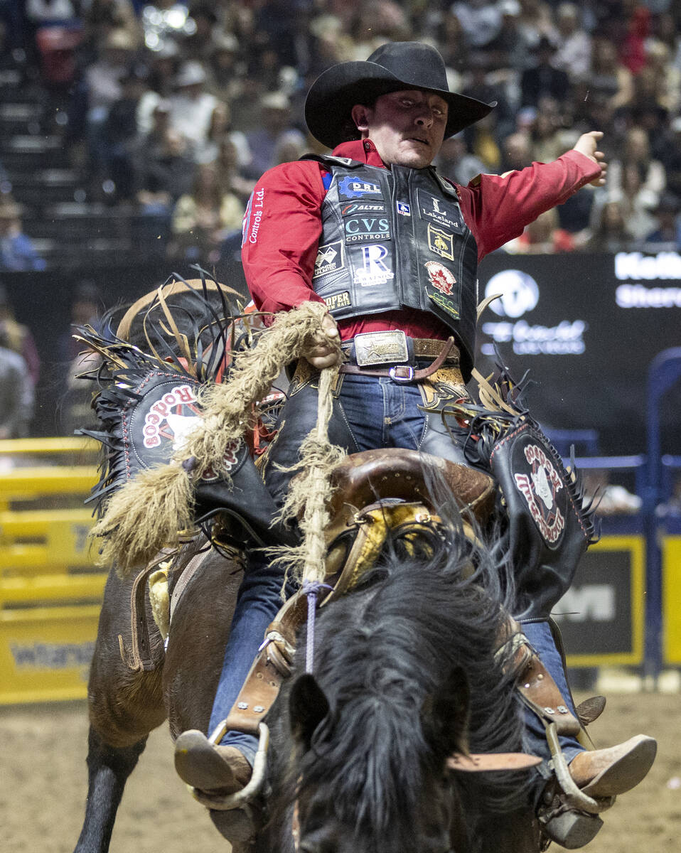 Kolby Wanchuk competes in the saddle bronc riding event during day nine of the National Finals ...