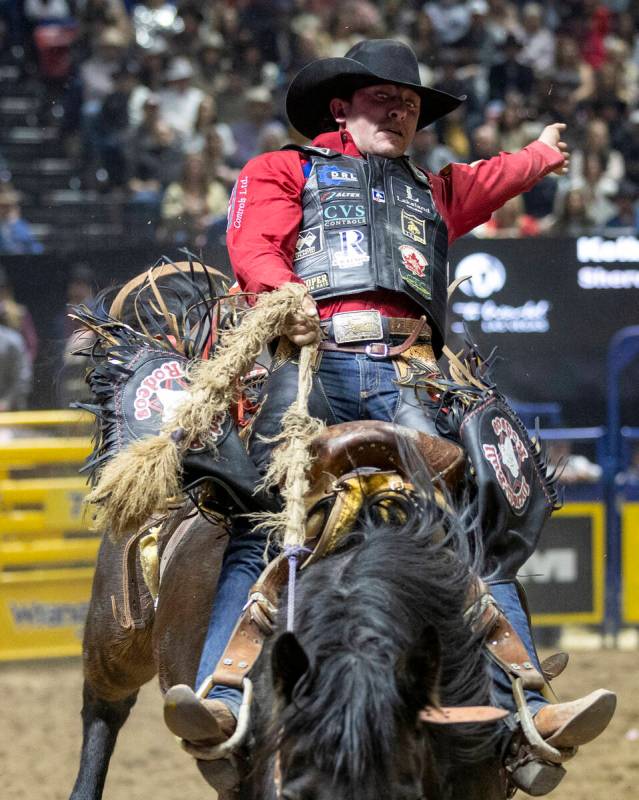 Kolby Wanchuk competes in the saddle bronc riding event during day nine of the National Finals ...