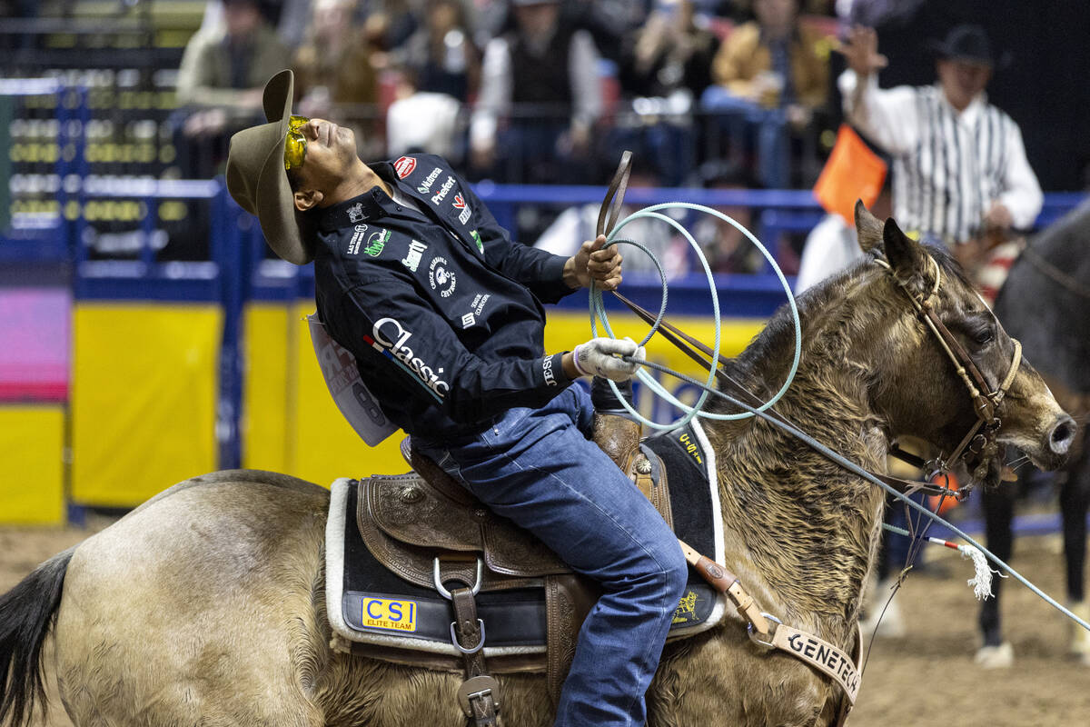 Junior Nogueira reacts after missing a calves hind legs while competing in the team roping even ...