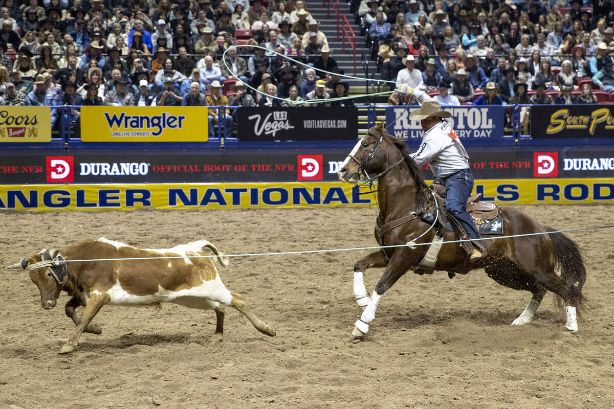 Shane Hanchey competes in the tie-down roping event during day nine of the National Finals Rode ...