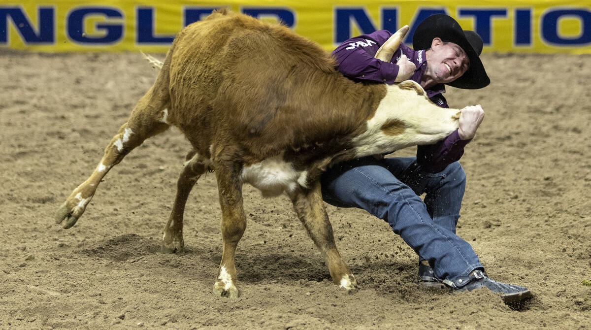 Dalton Massey competes in the steer wrestling event during day nine of the National Finals Rode ...