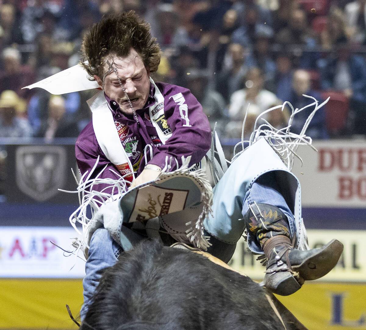 Keenan Hayes competes in the bareback riding event during day nine of the National Finals Rodeo ...