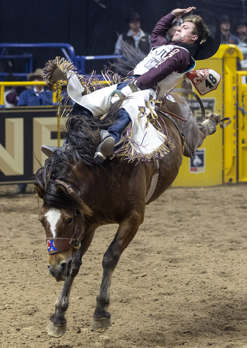 Weston Timberman competes in the bareback riding event during day nine of the National Finals R ...