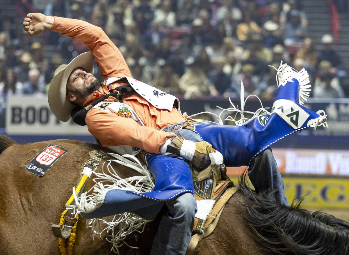 Taylor Broussard competes in the bareback riding event during day nine of the National Finals R ...