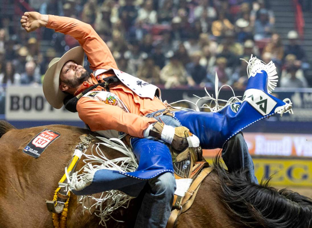 Taylor Broussard competes in the bareback riding event during day nine of the National Finals R ...