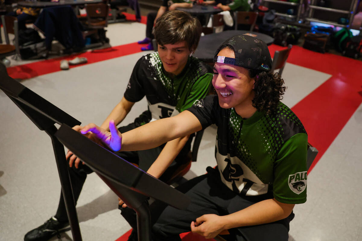 Palo Verde bowlers Jesse Del Carmen, right, and Jonathon Christ set up a game during a high sch ...