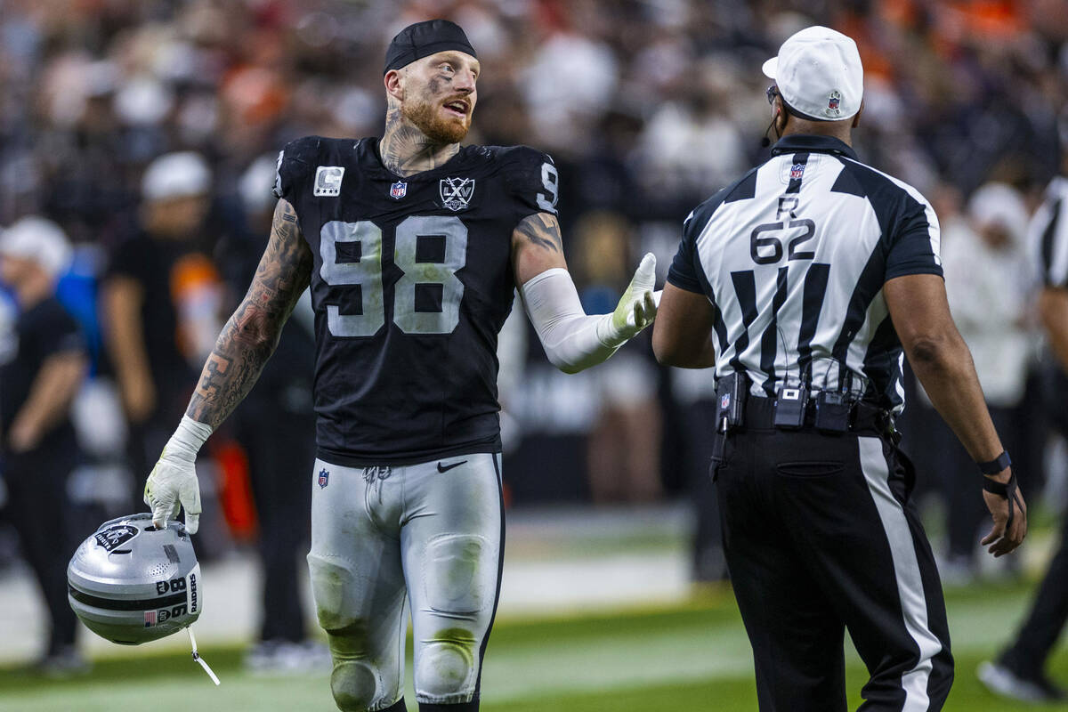 Raiders defensive end Maxx Crosby (98) chats with a referee during the second half of their NFL ...