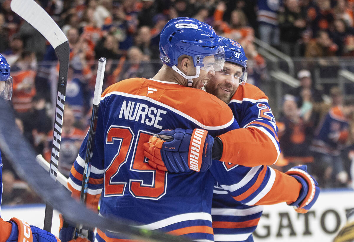 Edmonton Oilers' Darnell Nurse (25) and Leon Draisaitl (29) celebrate a goal against the Vegas ...