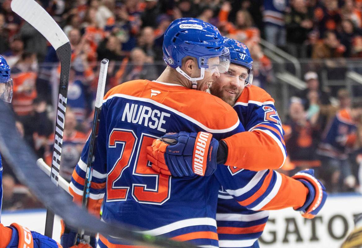 Edmonton Oilers' Darnell Nurse (25) and Leon Draisaitl (29) celebrate a goal against the Vegas ...