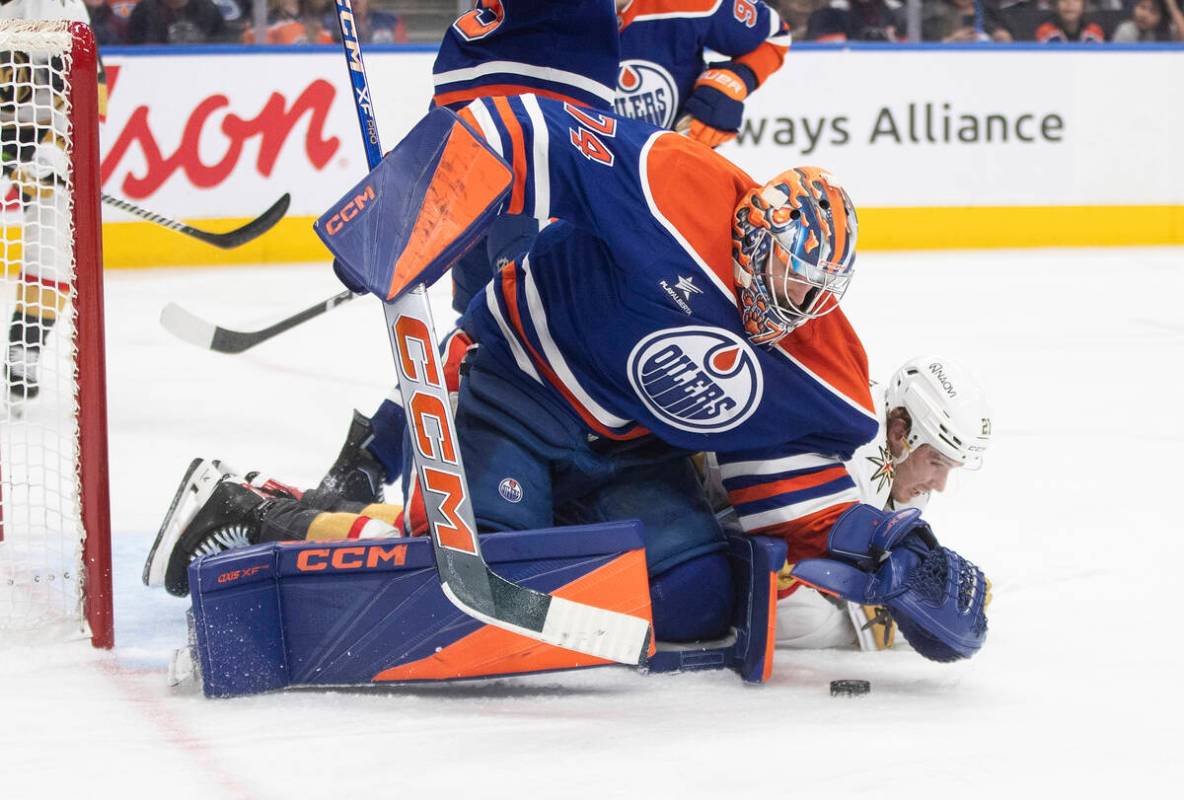 Vegas Golden Knights' Brett Howden (21) tries for the rebound on the save from Edmonton Oilers ...