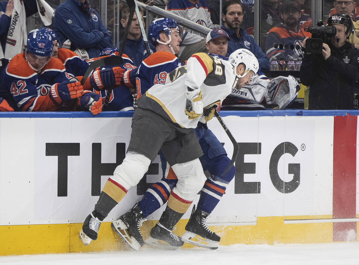 Vegas Golden Knights' Tomas Hertl (48) checks Edmonton Oilers' Ty Emberson (49) during the firs ...