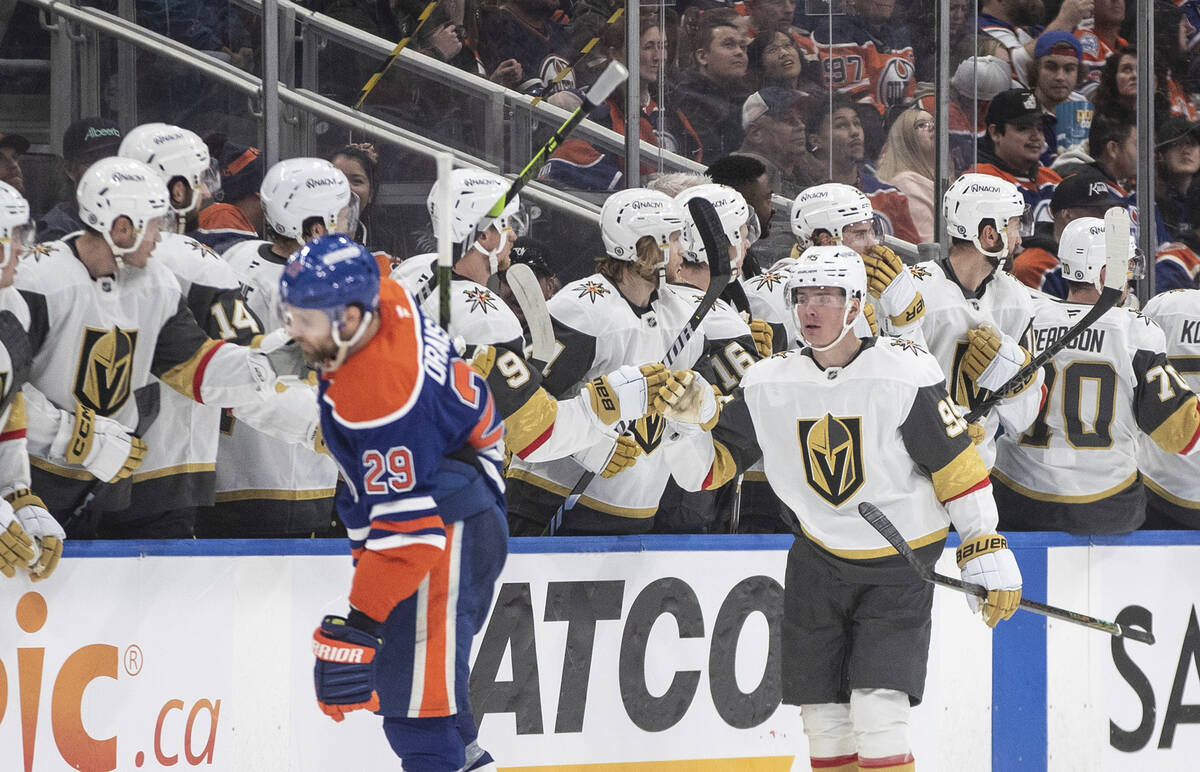 Vegas Golden Knights' Victor Olofsson (95) celebrates a goal as Edmonton Oilers' Leon Draisaitl ...