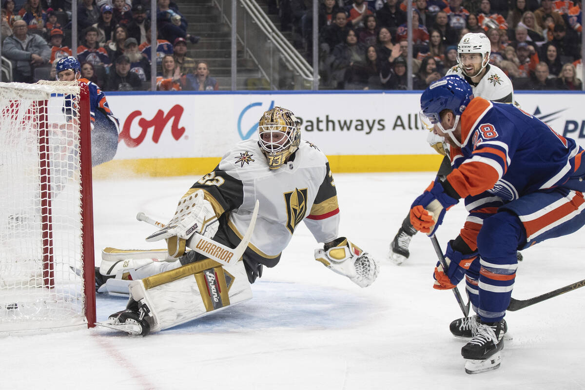 Vegas Golden Knights goalie Adin Hill (33) is scored on by Edmonton Oilers' Connor Brown (28) d ...