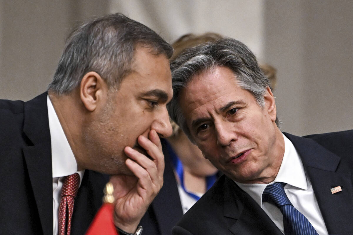 Turkey's Foreign Minister Hakan Fidan, left, speaks with US Secretary of State Antony Blinken d ...