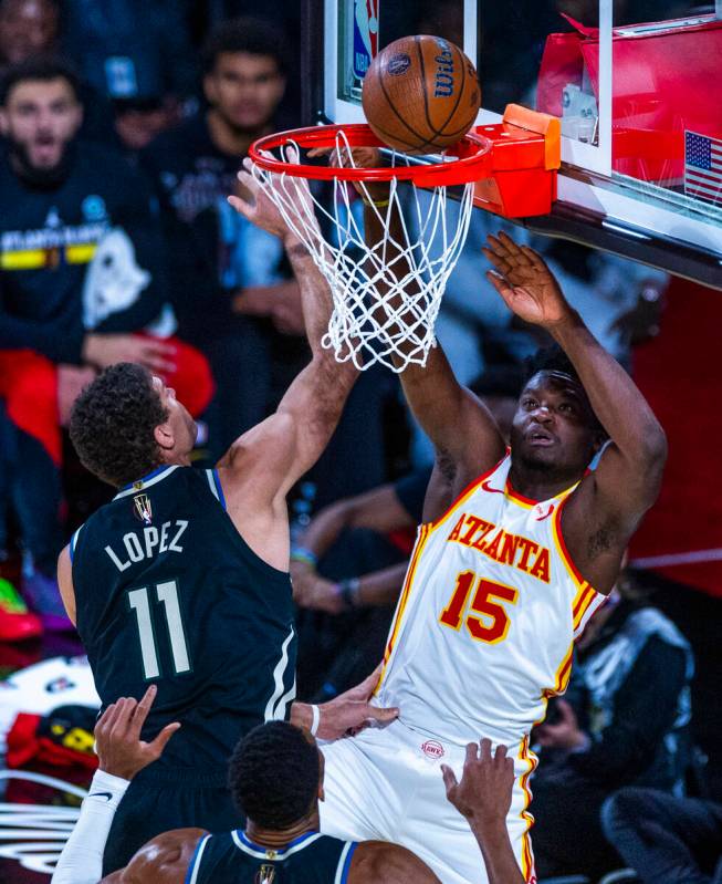 Milwaukee Bucks center Brook Lopez (11) is unable to stop a shot by Atlanta Hawks center Clint ...