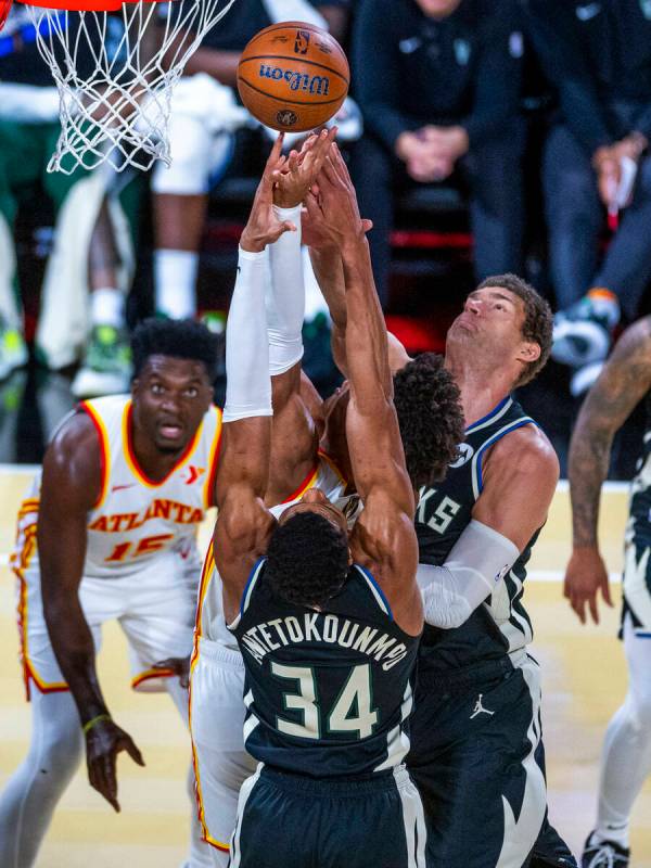 Milwaukee Bucks center Brook Lopez (11) rejects a shot attempt by Atlanta Hawks forward Jalen J ...