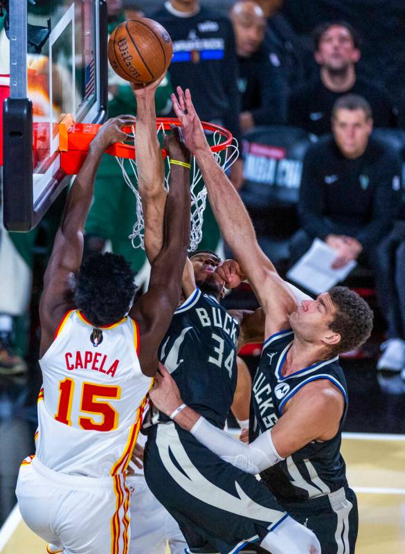 Milwaukee Bucks forward Giannis Antetokounmpo (34) blocks a shot in traffic by Atlanta Hawks ce ...