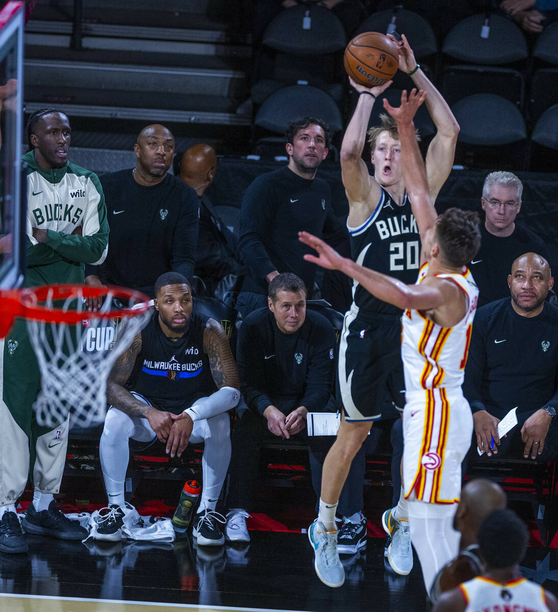 Milwaukee Bucks guard AJ Green (20) posts up for a three-point basket over Atlanta Hawks guard ...