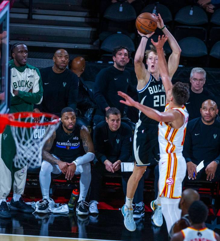 Milwaukee Bucks guard AJ Green (20) posts up for a three-point basket over Atlanta Hawks guard ...