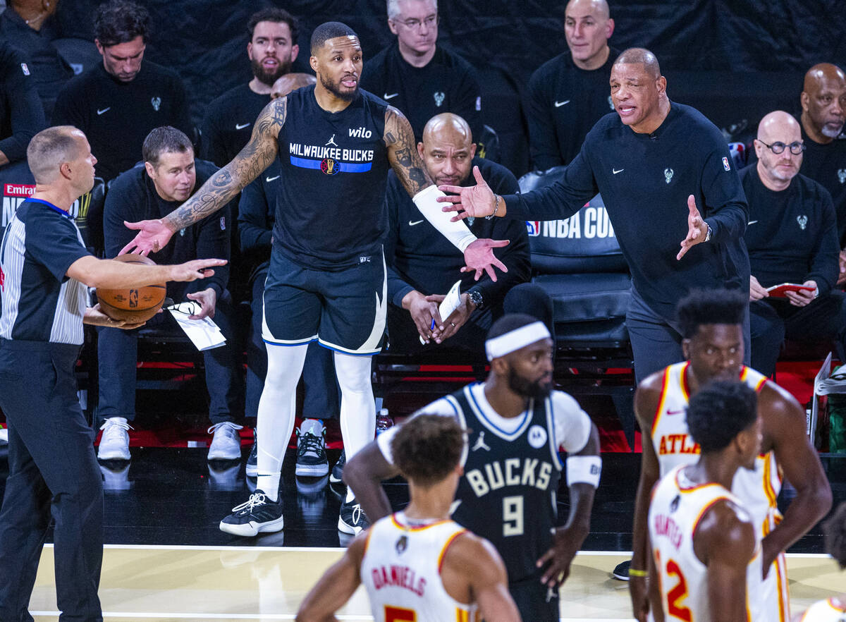 Milwaukee Bucks guard Damian Lillard (0) and head coach Doc Rivers appeal for a technical foul ...