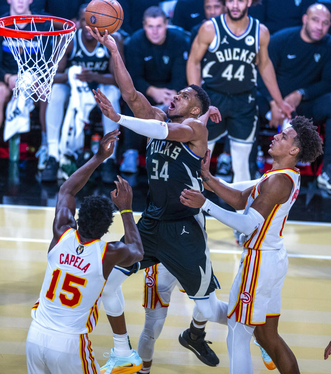 Milwaukee Bucks forward Giannis Antetokounmpo (34) soars to the basket for a score over Atlanta ...