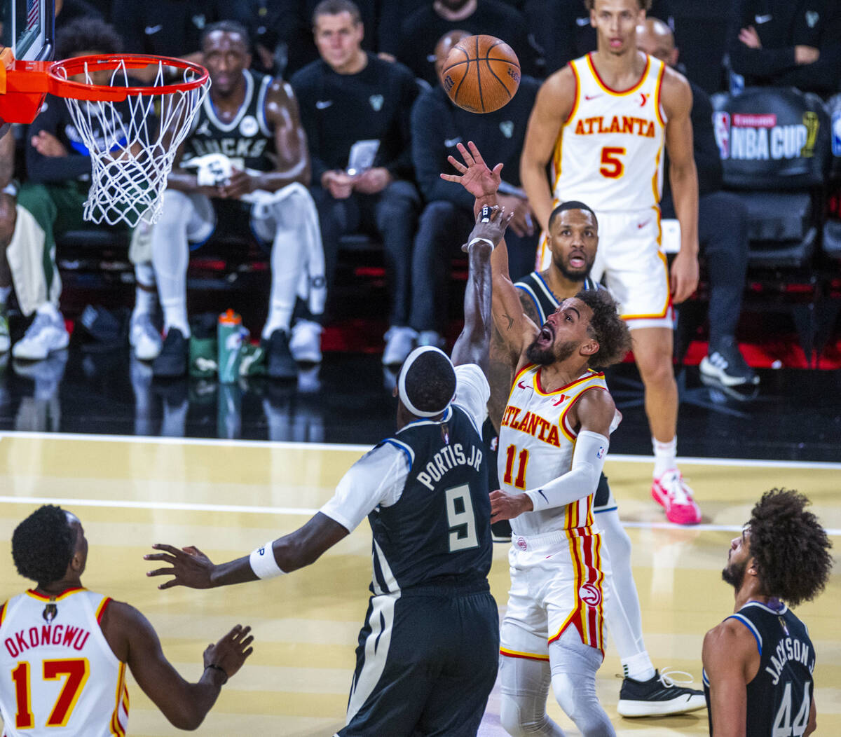 Atlanta Hawks guard Trae Young (11) gets off a shot over Milwaukee Bucks forward Bobby Portis ( ...