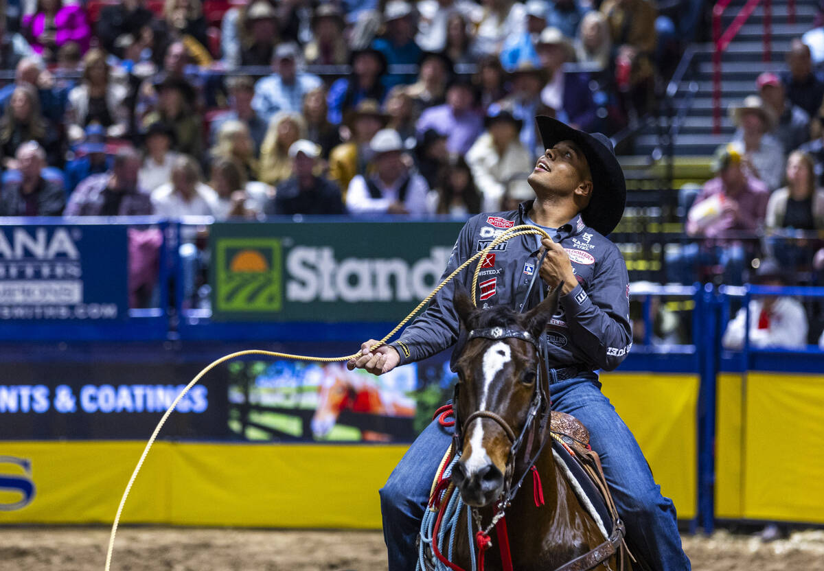 Tie-Down Roping competitor Shad Mayfield looks to the replay during National Finals Rodeo Day 2 ...