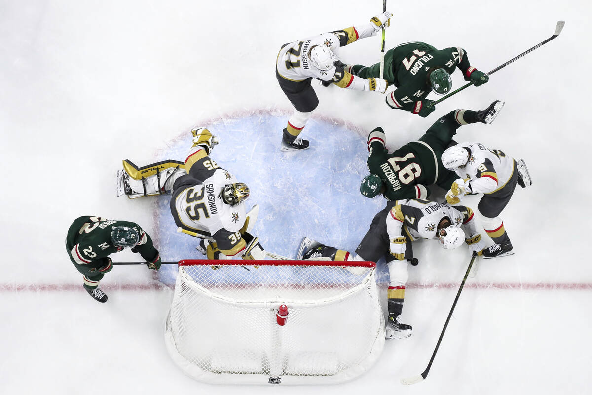 Vegas Golden Knights defenseman Alex Pietrangelo, bottom right, defends the puck as time expire ...