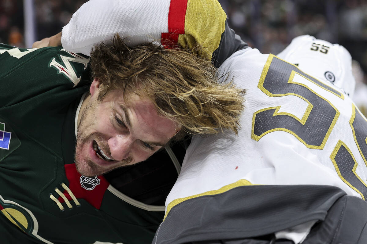 Minnesota Wild left wing Marcus Foligno, left, and Vegas Golden Knights right wing Keegan Koles ...