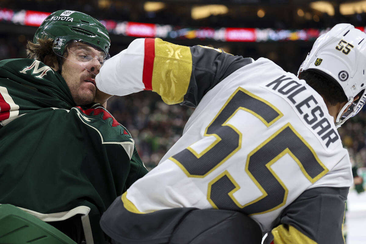 Minnesota Wild left wing Marcus Foligno, left, and Vegas Golden Knights right wing Keegan Koles ...