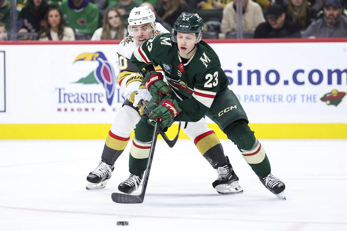 Minnesota Wild center Marco Rossi (23) skates with the puck as Vegas Golden Knights left wing T ...