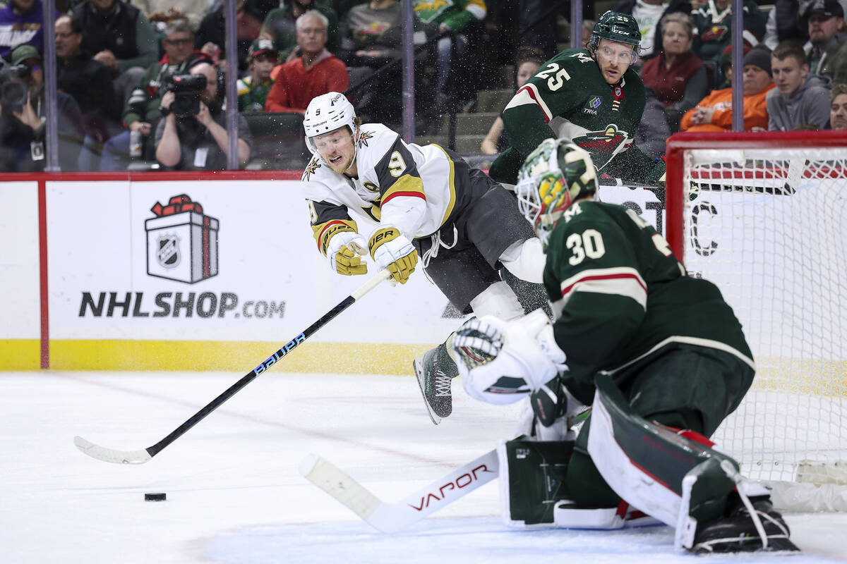 Vegas Golden Knights center Jack Eichel (9) reaches for the puck as Minnesota Wild goaltender J ...