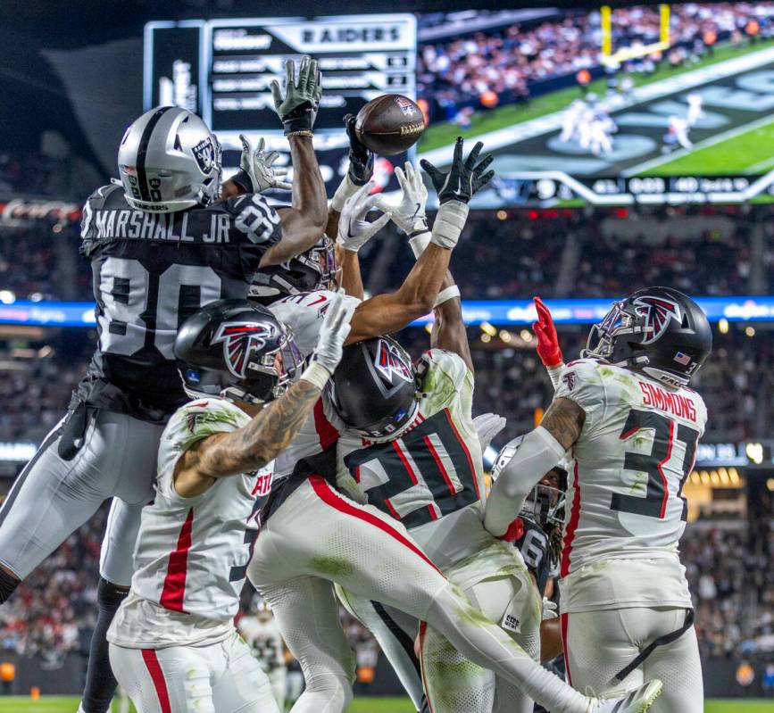 *Raiders wide receiver Terrace Marshall Jr. (80)is in great position to grab a Hail Mary pass a ...