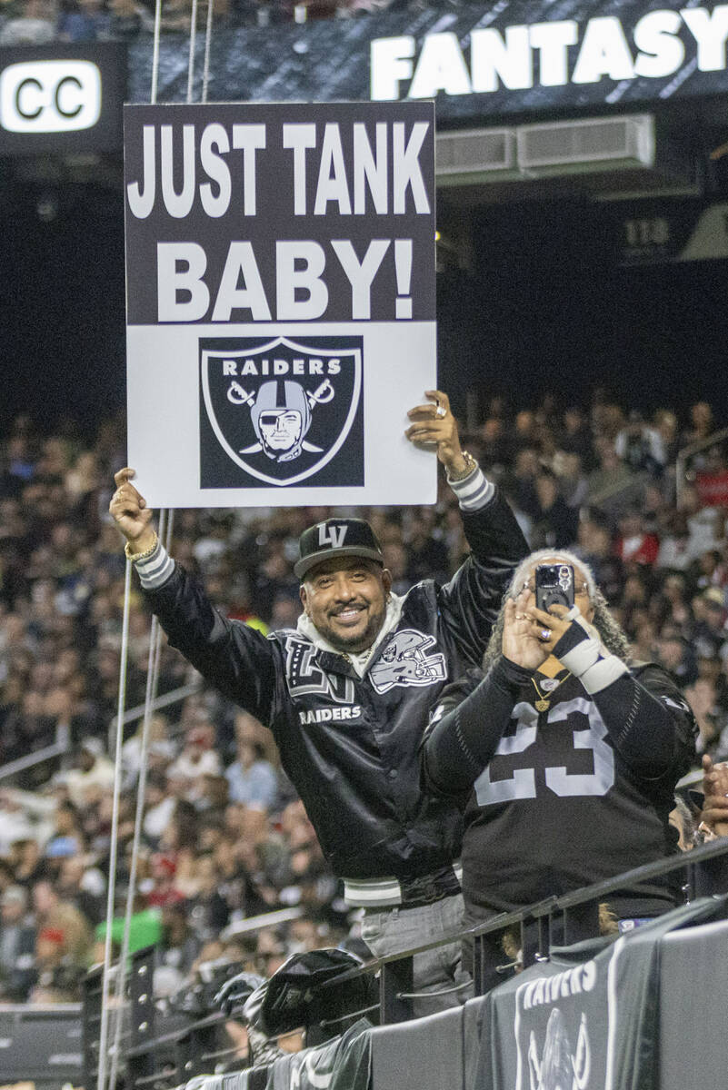 “Vegas” Ralph Sotelo holds up a sign during the first half of an NFL game between ...